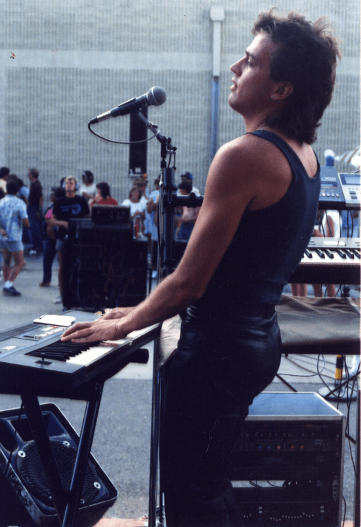 Musician Allen Wheeler playing keyboards at outdoor gig